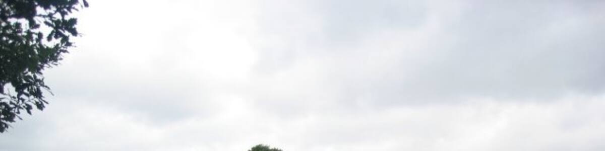 Photo "Railway bridge Old railway bridge in the extreme north-east of this square. From here the line used to run north-west into Thorner and cross Main Street." by Chris McLean (Creative Commons Attribution-Share Alike 2.0) / Cropped from original