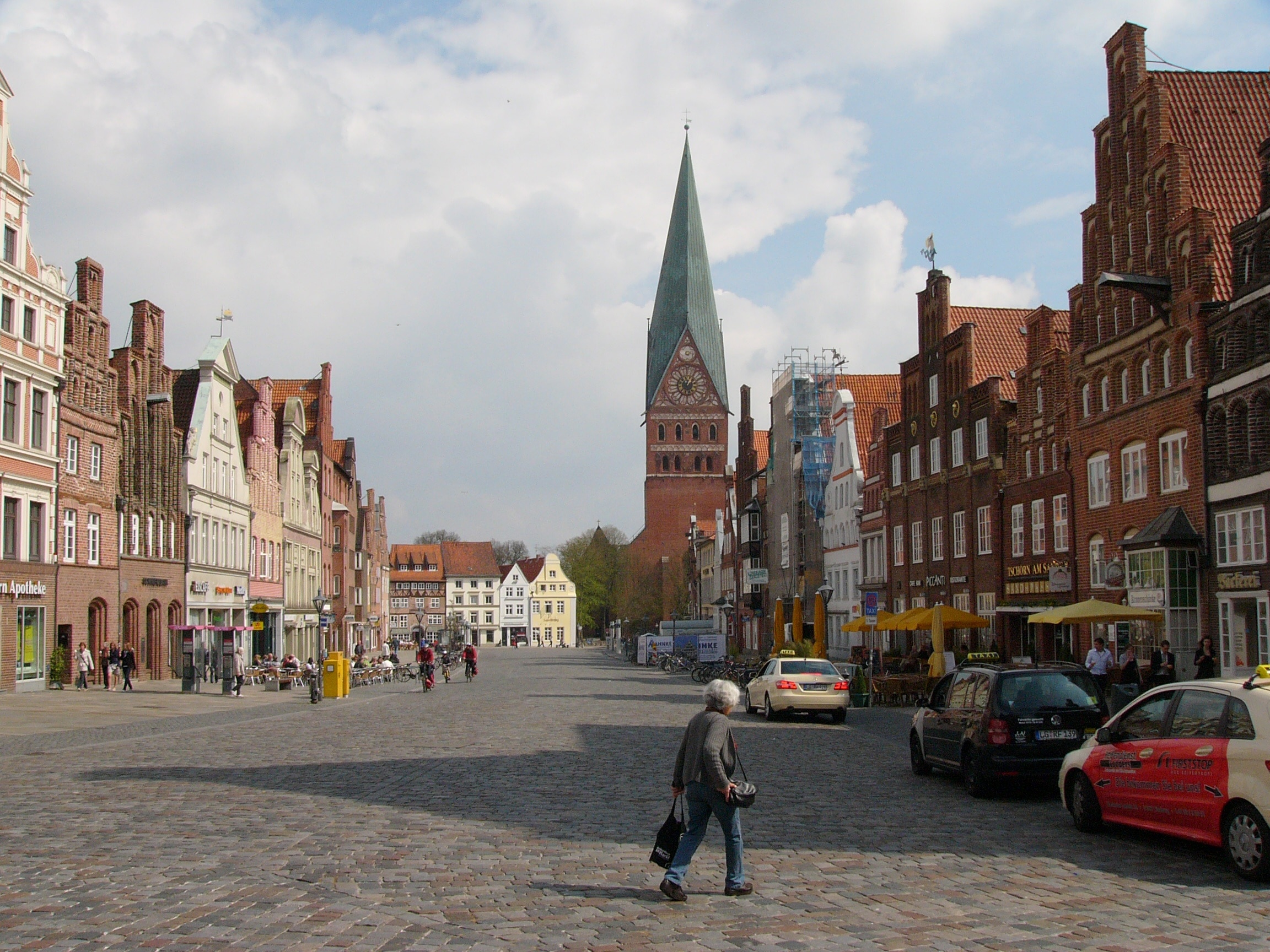 Street Am Sande and view to church St. Johannis in Lüneburg, Germany