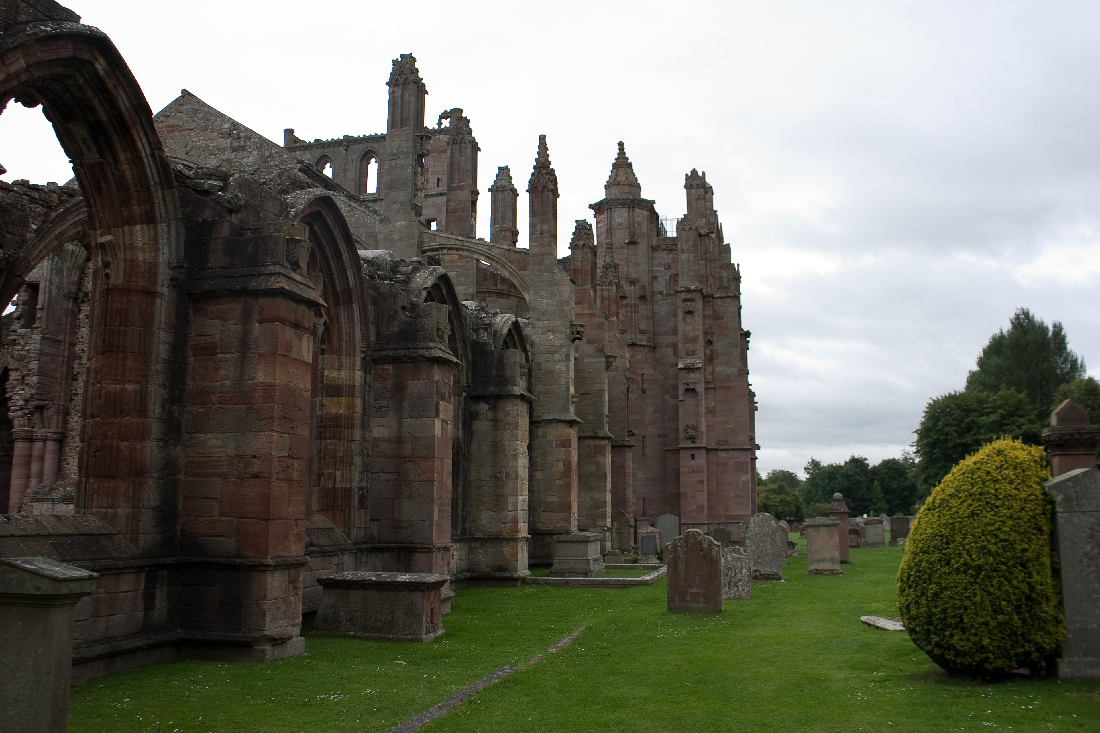 Melrose Abbey is located in Melrose, Scotland. It was built in 1138 and abandoned in 1609; it is now a ruin. It is considered to be one of the most beautiful church buildings in the United Kingdom.