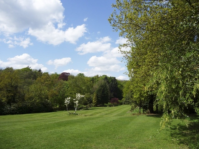 Ponsbourne Park Hotel, Newgate Street, Hertfordshire Spring view of beautifully cut lawn and spring blossom on the tree.