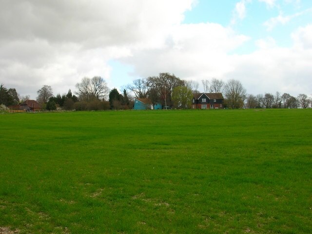 House near Hurst Farm On the promontory overlooking the Rother Levels. Taken from the borders of College Wood.