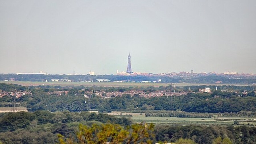 Photo "Tower View Blackpool Tower, distance 20 miles, from Church Lane Heskin" by Galatas (Creative Commons Attribution-Share Alike 2.0) / Cropped from original