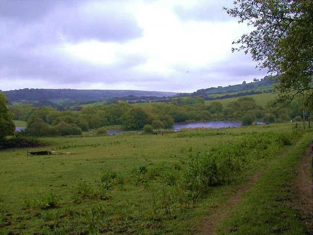 Path to Wally's Lake. Wally's lake is freshwater fishing lake. The land leading down to it is used by a riding school.