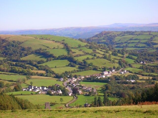 Talley and the Beacons beyond from community woodland Village in foreground from one of the community woodland tracks