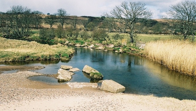 Lunan Water. In the river are the remnants of WWII concrete tank traps.