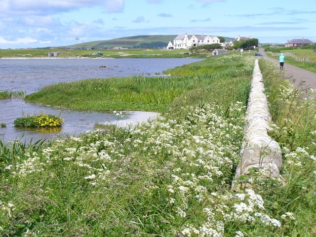 Loch of Harray Banks, by Russland Looking north from the converted mill towards the Merkister Hotel. The loch is used by anglers.