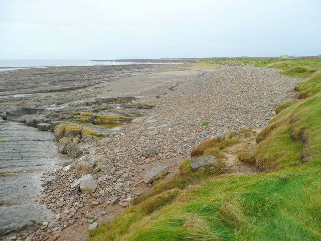 Rest Bay coastline Looking north-west towards the expanse of the flat Ffynnon-wen Rocks. Sker Point is in the distance.