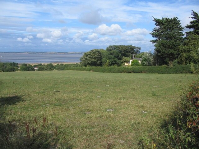 The view from Ffordd Isglan. A view looking to the northeast towards the Dee estuary from the start of the public footpath on Ffordd Isglan (Isglan Road), which runs behind the hedge at right.