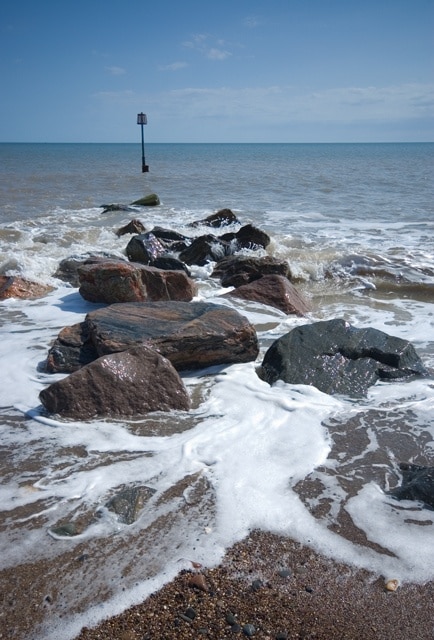 North Groyne, Mappleton, East Riding of Yorkshire, England. Showing the remains of one of the pair of boulder breakwaters constructed in 1991 to protect the village from the rapid erosion of the Holderness coastline.