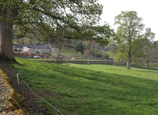 Houses on Darley Road, Birstwith. Seen across a meadow. This is close to 68163.