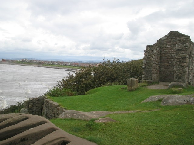 St Patrick's Chapel (remains) Heysham in background; Stonecut graves in foreground