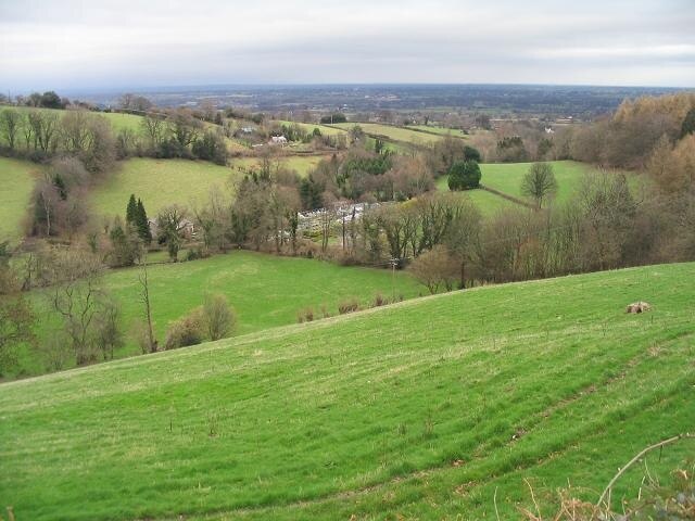 View from the B4579 In the centre of the photo are greenhouses. The Cheshire Plain is in the background.