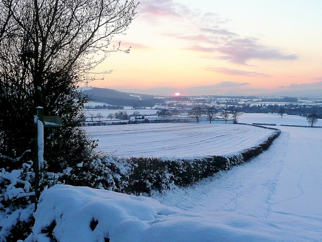 Snowy footpath Looking south-west from the A466 at King's Thorn. A wintery sunset in view, Orcop Hill to the left.