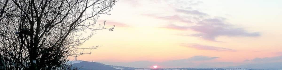 Photo "Snowy footpath Looking south-west from the A466 at King's Thorn. A wintery sunset in view, Orcop Hill to the left." by Jonathan Billinger (Creative Commons Attribution-Share Alike 2.0) / Cropped from original