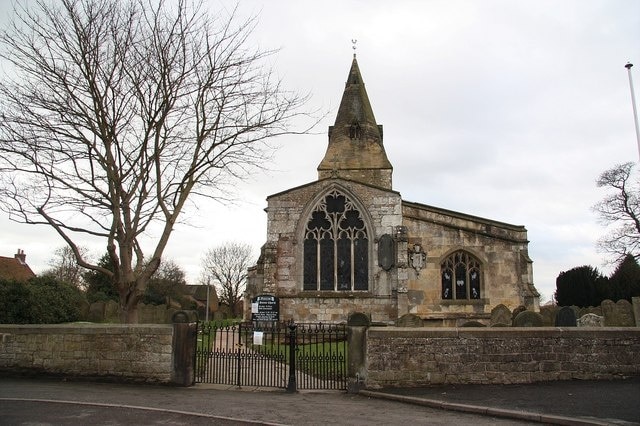 All Saints' church Rebuilt 1843-7, presumably including the strange east window with unusual quatrefoil tracery