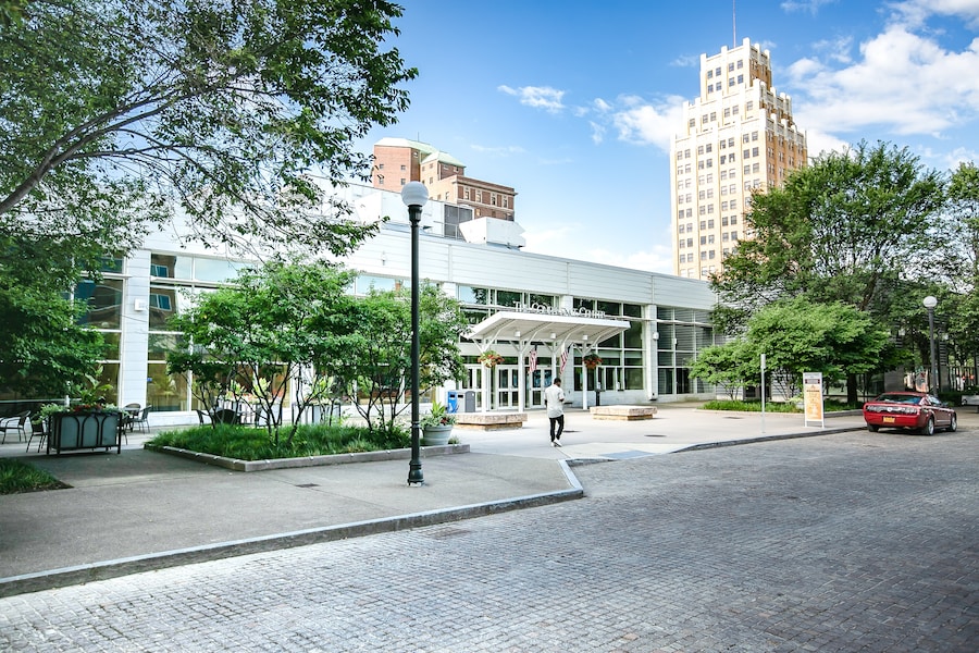 Pedestrian-friendly Old Falls Street with outdoor seating and greenery.
