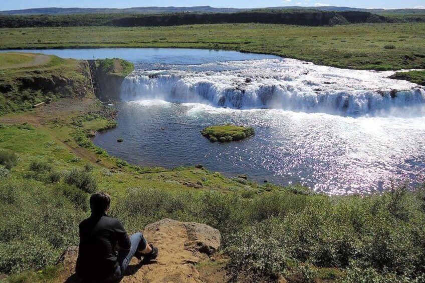 The waterfall Faxi in the river Tungufljót in South region in Iceland is only twelve kilometers from the famous Geysir hot spring area .