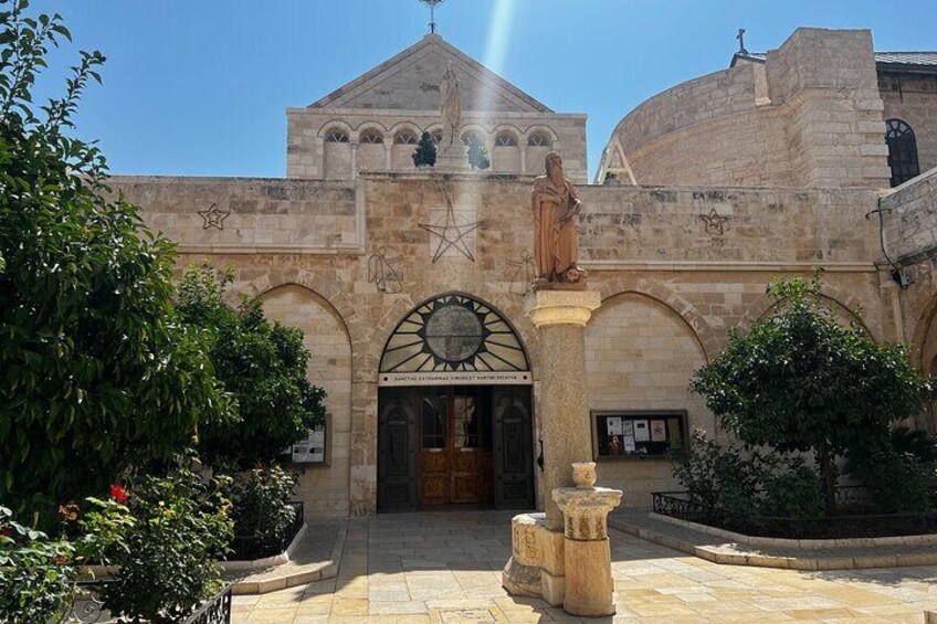 Statue of Saint Jerome in front of Saint Catherine Church, a highlight of your Bethlehem half-day exploration, encapsulating the rich heritage of the region's cultural and religious significance.