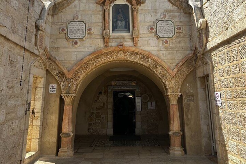 Visitors immersed in serenity at the Milk Grotto Church, an enchanting stop on your Bethlehem half-day tour, delving into the region's spiritual heritage and cultural marvels.