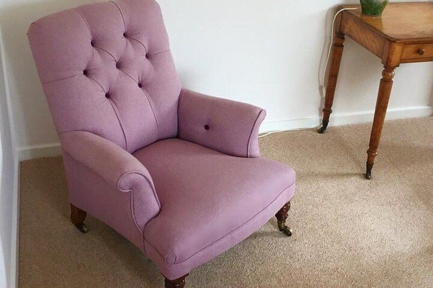 Deep buttoned armchair