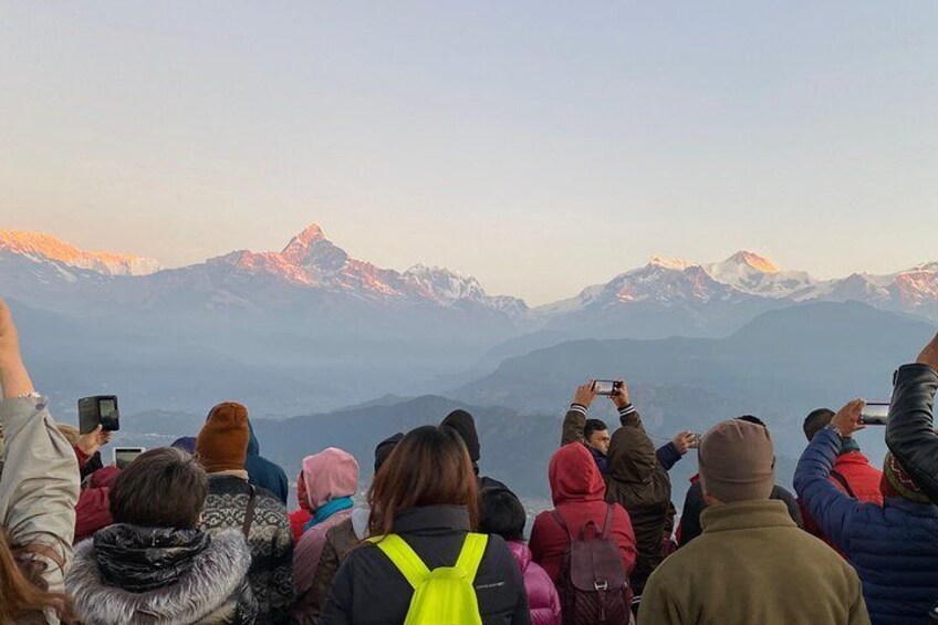 Our guests are taking pictures of the gorgeous Himalayan mountain views from Sarangkot hill.