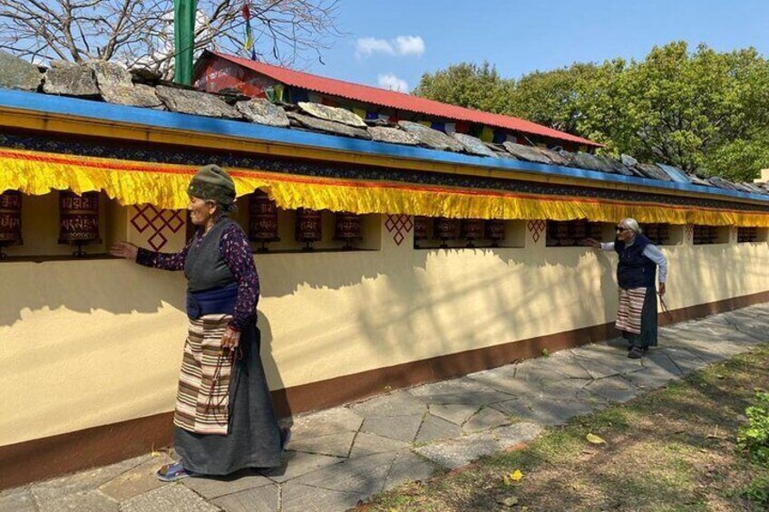 Elderly woman circumambulating the temple. 