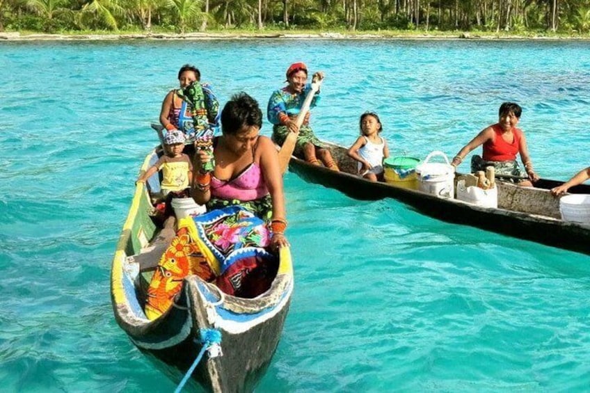Gunas in their traditional dugout canoes