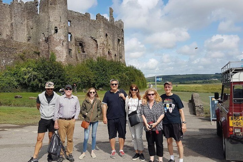A tour arrives at Laugharne.