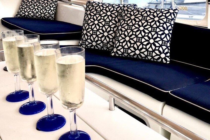 Complimentary glass of bubbles on boarding