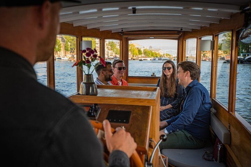 The boat has a wooden top in the front.