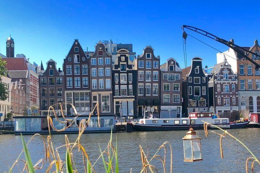 Leaning canal houses on the Amstel river