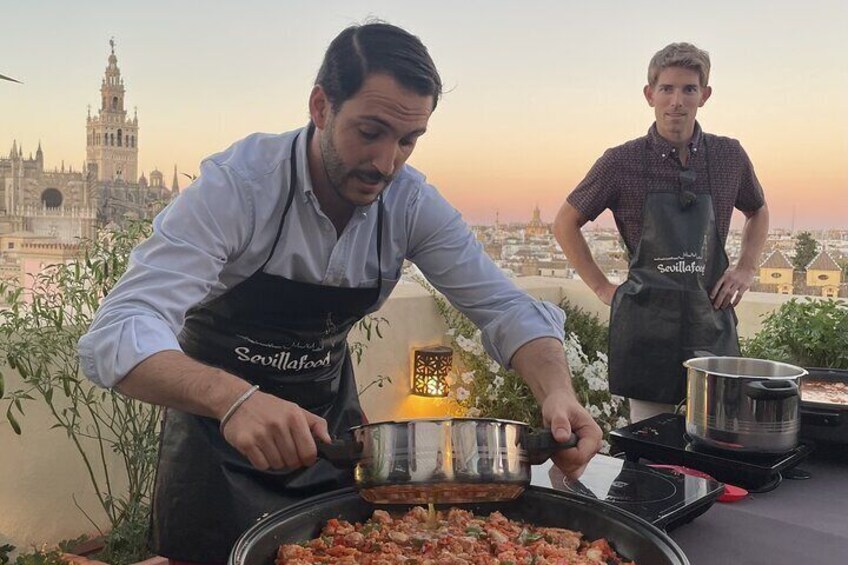 Exclusive Paella cooking class on private Rooftop with Seville's Cathedral View