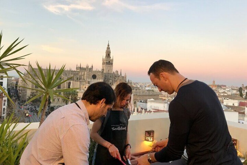 Exclusive Paella cooking class on private Rooftop with Seville's Cathedral View