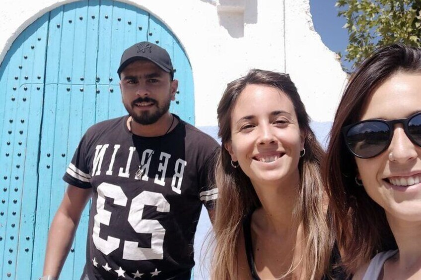 Sami with his clients behind them the th pricipal door signe of chefchaouen