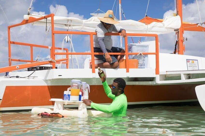 Thanks to a floating sandbar you can enjoy a drink while lounging in the warm waters of Punta Cana.