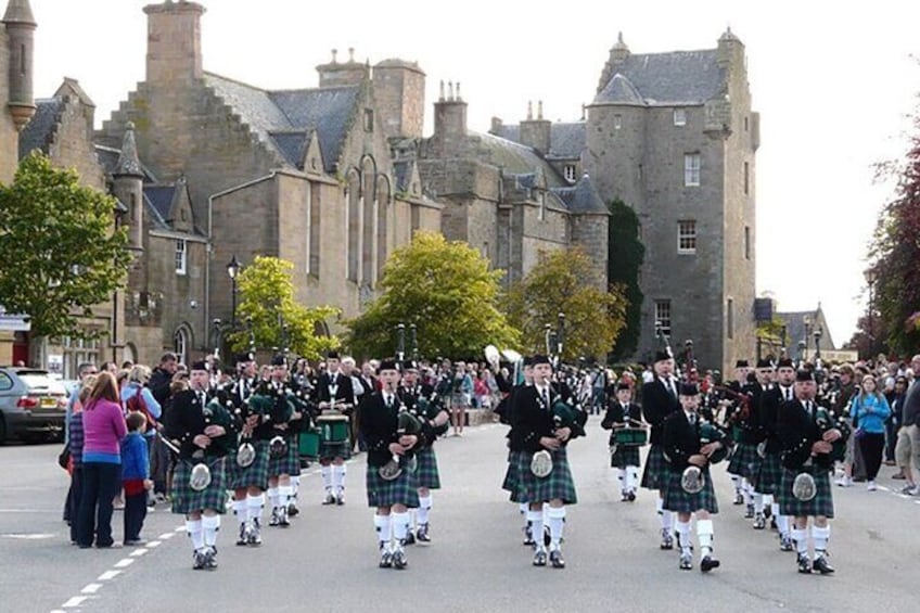 Dornoch with Pipe Band in Town Square