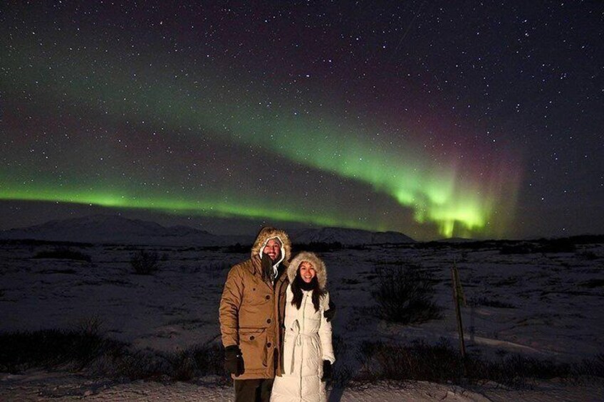 Enjoying a romantic night under the dancing lights.