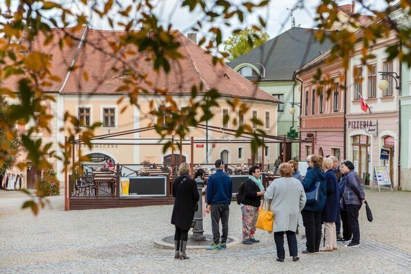 In the fall, the vibrant autumn leaves compliment the colorful Old Town buildings.