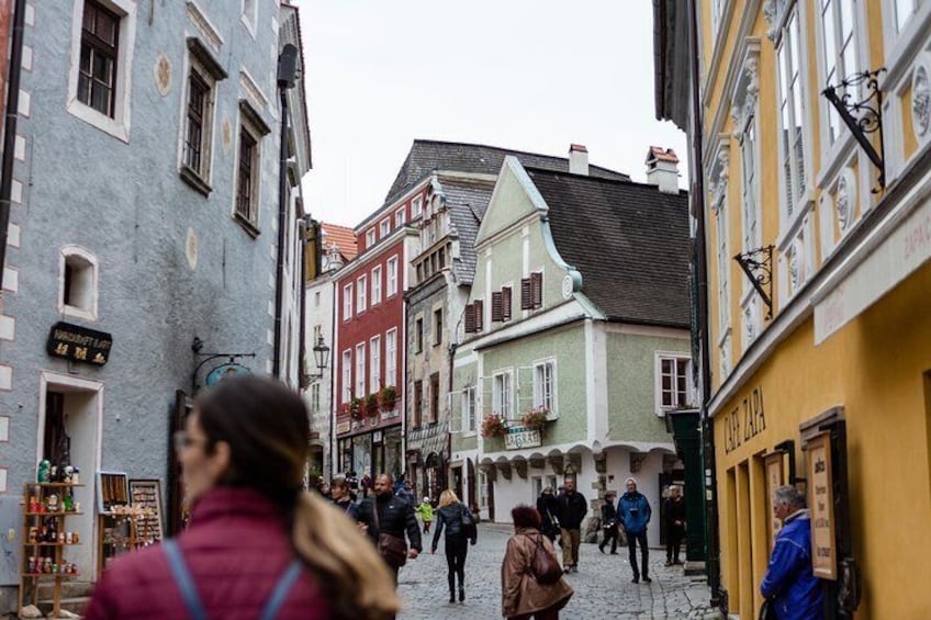 The town center of Cesky Krumlov is full of colorful and historic houses, souvenir shops, and quaint cafes.
