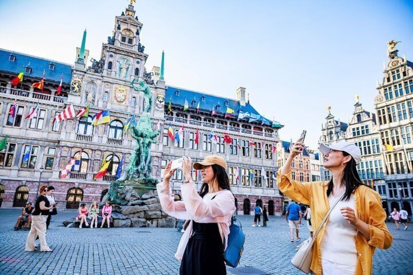 Our tourists taking pictures of the main Square of Antwerp