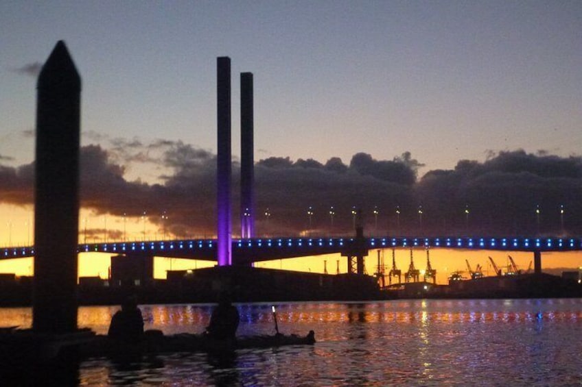 Stopping for a snack with Bolte Bridge in background