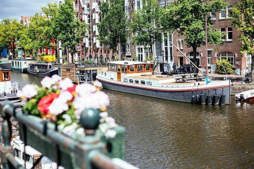 Walk along the canals and discover best hidden gems with your private local guide in Amsterdam