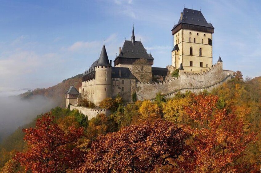 Karlstejn Castle in the morning fog