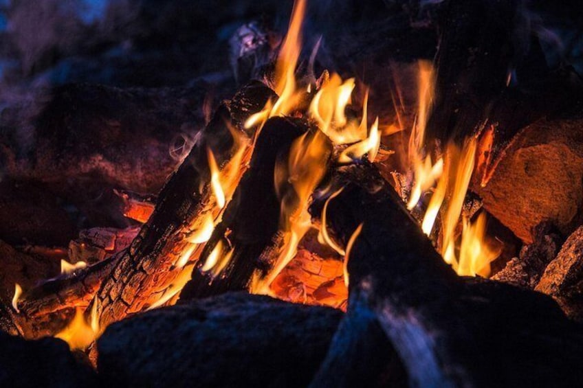 Dinner by open fire in lappish teepee