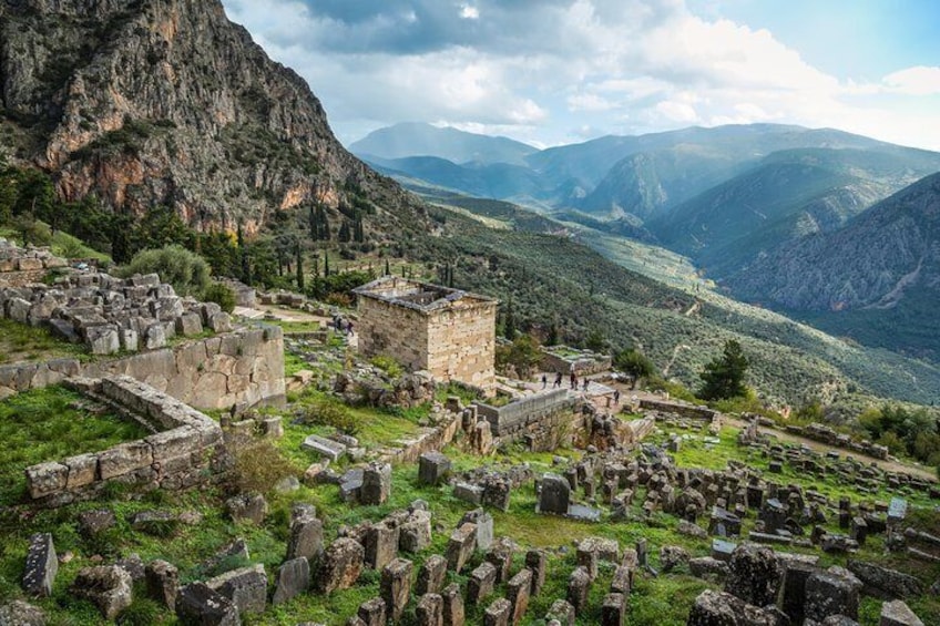 Delphi is nestled in the lush mountains of Mount Parnassus known as the Phaidriades Rocks and contains the sanctuary of Apollo as well as various other ancient buildings.