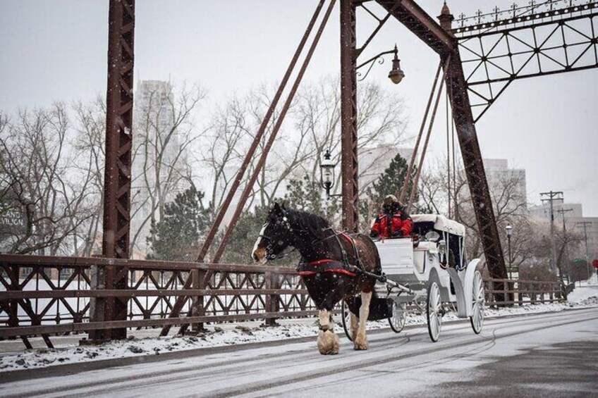 Show item 2 of 4. Going over the Merriam Street bridge from the Nicollet Island