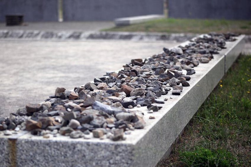 Pay respect at the grave sites, where the ashes of many victims were buried together