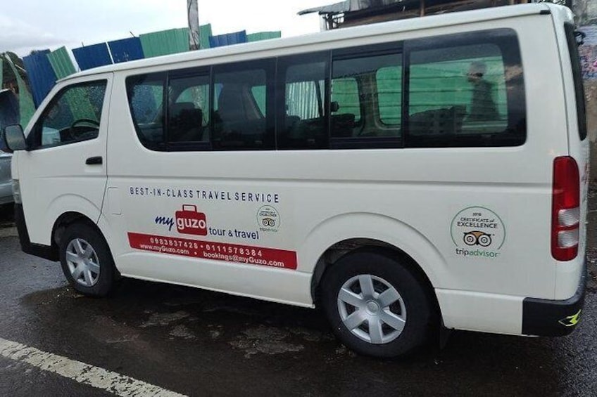 An AC equipped minibus ready for customer pickups