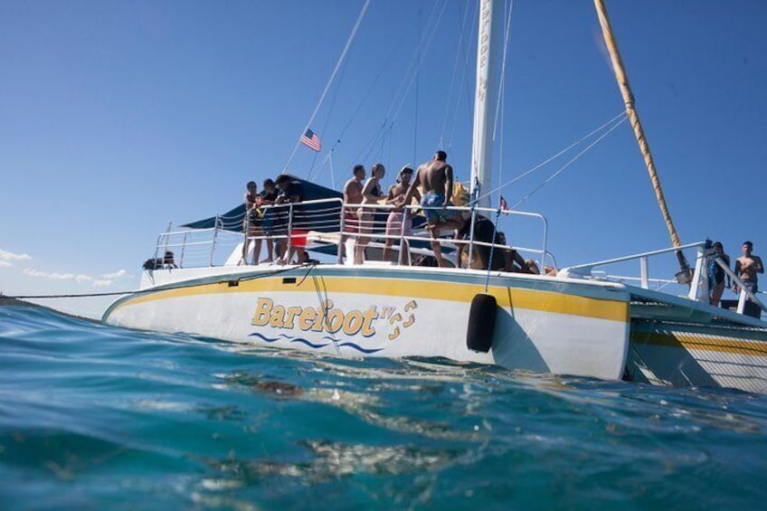 Travelers soak up the sun on deck just off the coast of Fajardo, Puerto Rico.