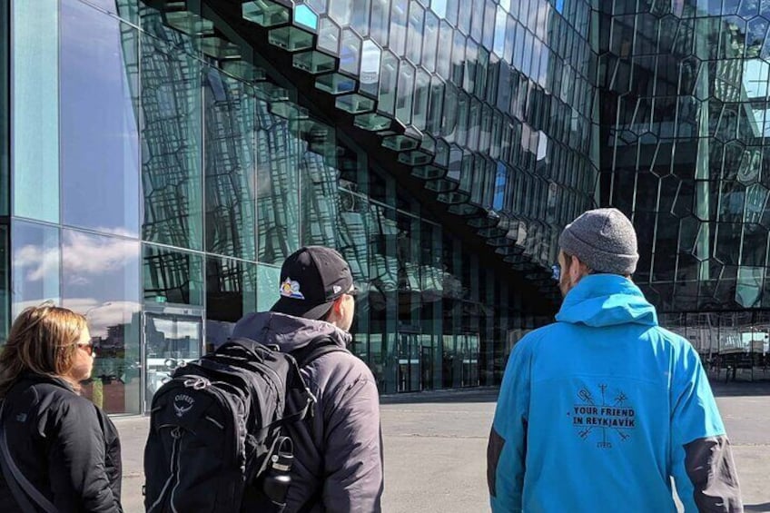 Our guide explaining the history and architecture of the Harpa Concert Hall in Reykjavik